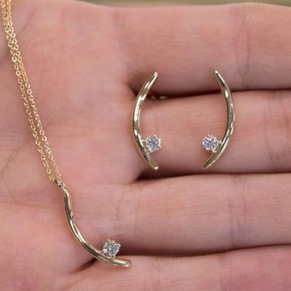 The Signature Verana Set in 10k yellow gold with diamonds, shown in hand
