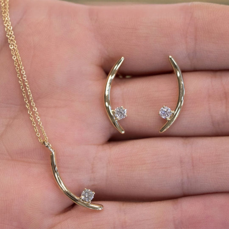 The Signature Verana Set in 10k yellow gold with diamonds, shown in hand