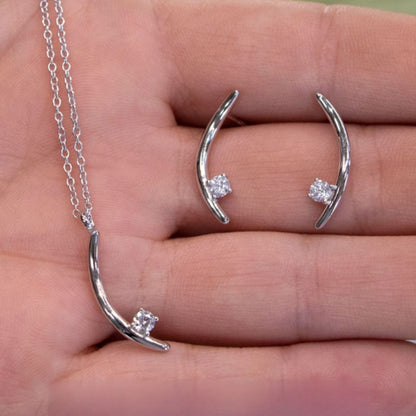 The Signature Verana Set in 10k white gold with diamonds, shown in hand