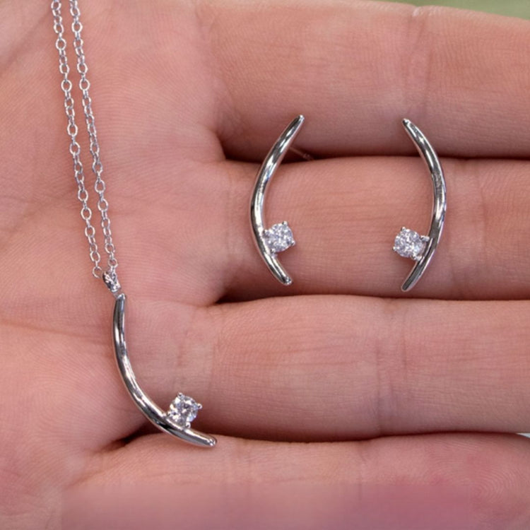 The Signature Verana Set in 10k white gold with diamonds, shown in hand